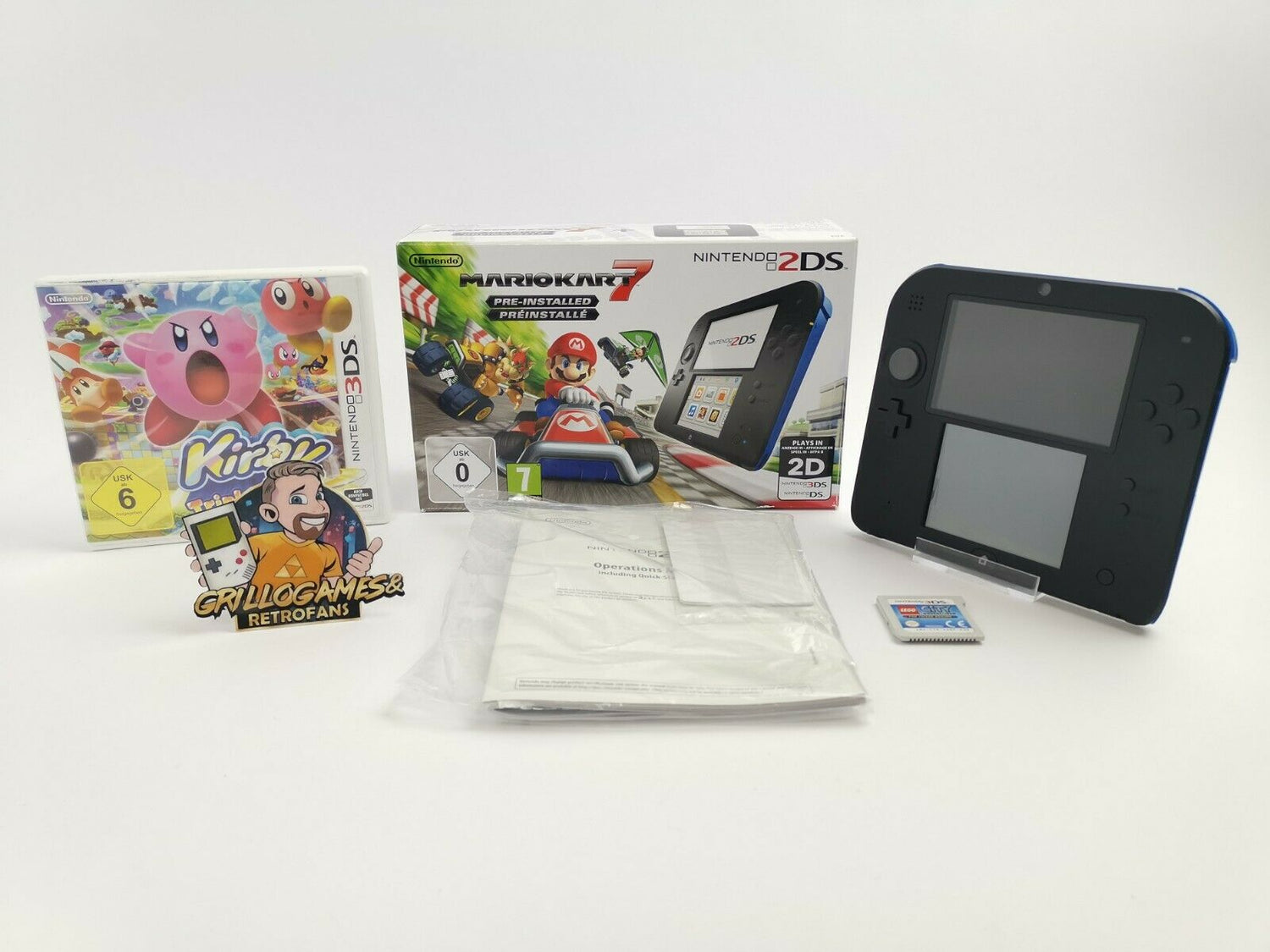 Nintendo 2ds console with Kirby and Lego City