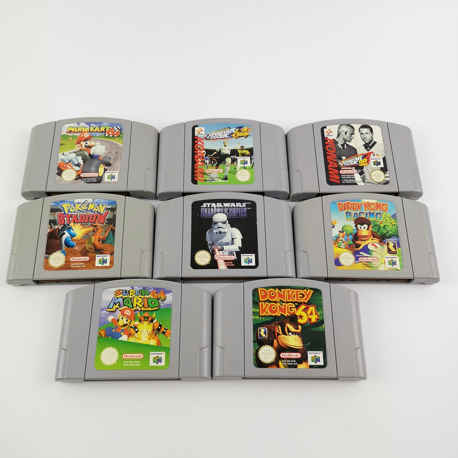Nintendo 64 console: cable, 2 controllers, 8 games, expansion pack etc. N64
