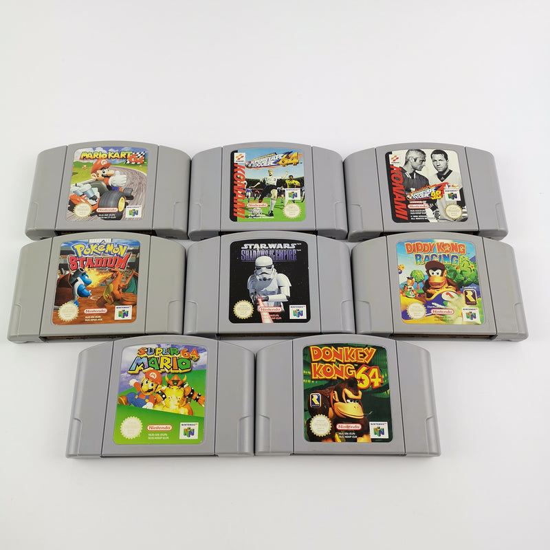 Nintendo 64 console: cable, 2 controllers, 8 games, expansion pack etc. N64
